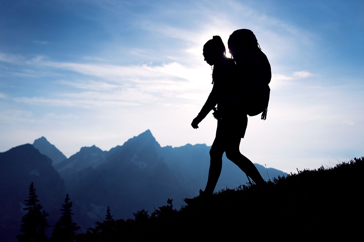 Backpack fit (silhouette of backpacker in mountains)